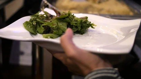 Hands spooning Risotto onto plate Stock-Footage 118977416