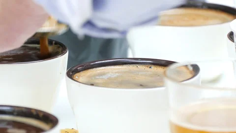 Hands with spoons remove foam with coffee Stock-Footage 90858639