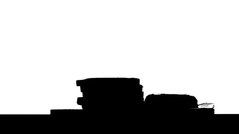 Hands spread a butter on a bread silhouette Stock Footage 83297355