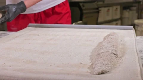 Hands spread the dough for the baguette Stock-Footage 155521945