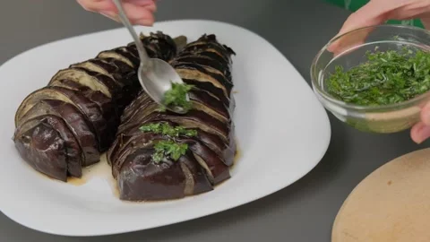 Hands Sprinkling Herbs on Rolls Cooking Kitchen Video stock 341421645