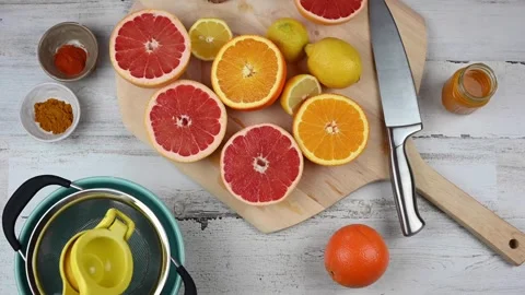 Hands Squeezing Fresh Organic Lemons. Lemon is pressed on with hand juicer. Stock Footage 265839249