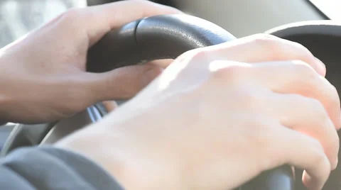 Hands squeezing the wheel of a car Stock Footage 62079833