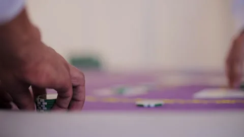 Hands stacking casino chips on table Stock Footage 317563926