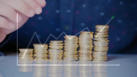 Hands Stacking Gold Coins with Upward Financial Graph Stock Footage 335830725