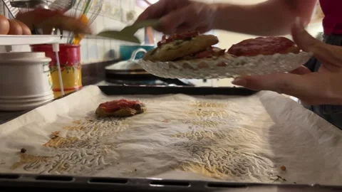 Hands stacking Valencian coca on plate Stock Footage 342822180