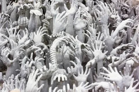 Hands statue from hell Stock Photos