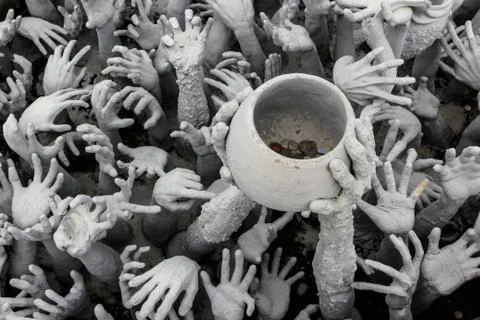 Hands statue from hell Stock Photos