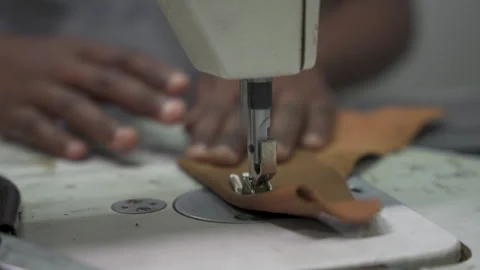 Hands Steadily Guiding Leather Under Sewing Machine Needle Stock Footage 336039191