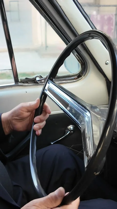Hands on Steering Wheel of a Classic Car Stock Footage 341979838