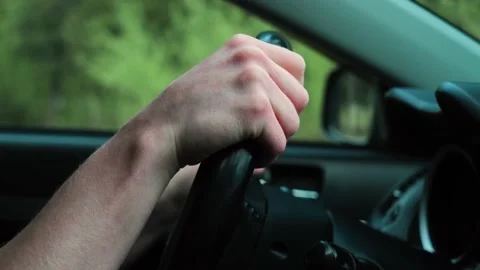 Hands on the steering wheel close-up. Stock Footage 154657400
