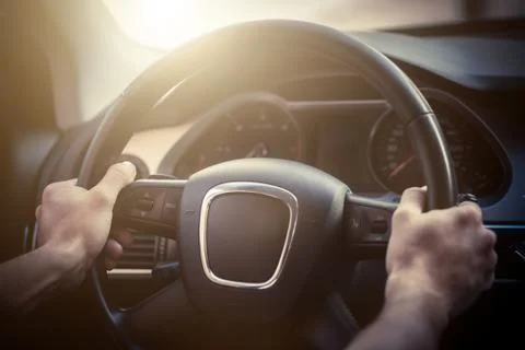 Hands on steering wheel Stock Photos