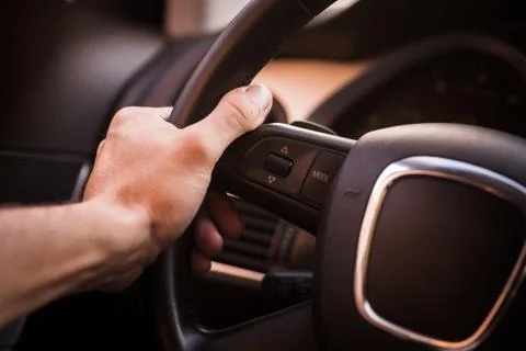 Hands on steering wheel Stock Photos