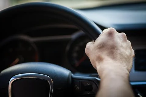 Hands on steering wheel Stock Photos