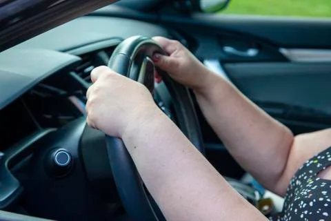 Hands on the steering wheel Stock Photos