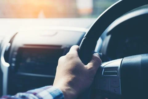 Hands on the steering wheel Stock Photos
