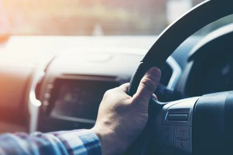 Hands on the steering wheel Stock Photos
