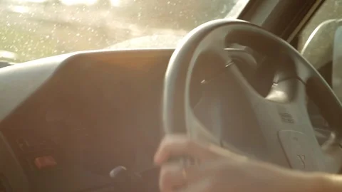 Hands on Steering Wheel with Sun Flare and Wheel Turn Видео 89153289