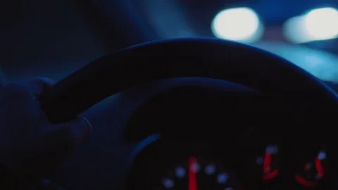 Hands on steering wheel, unfocused dashboard, night driving Stock Footage 104129108