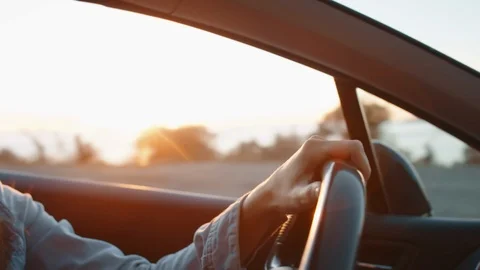 Hands on the steering wheel while driving Video stock 116178804