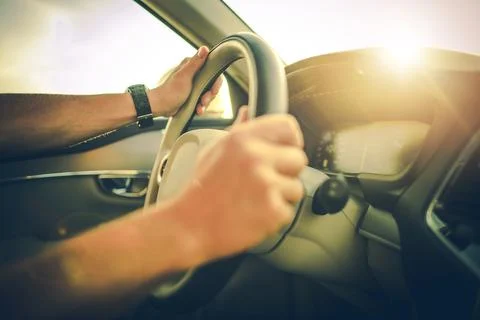 Hands on the Steering Wheel While Driving a Car Stock Photos