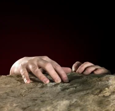 Hands on stone surface Stock Photos