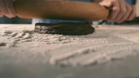 Hands stretching dough on the table Stock Footage 71037277