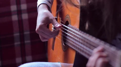 Hands on the strings of the guitar Stock-Footage 53197670