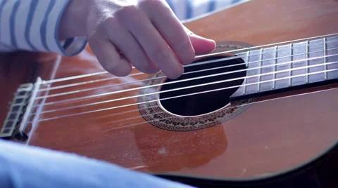 Hands on the strings of the guitar Stock-Footage 53198817