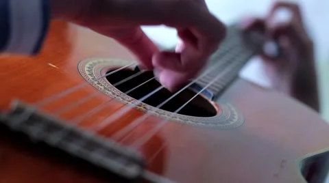 Hands on the strings of the guitar Stock-Footage 53198818