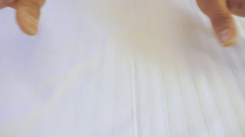 Hands stroking the white fabric, background Stock Footage 115577050