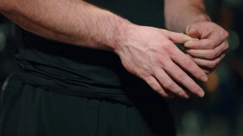Hands of strong man checking fingers after workout Stock Footage 157558655