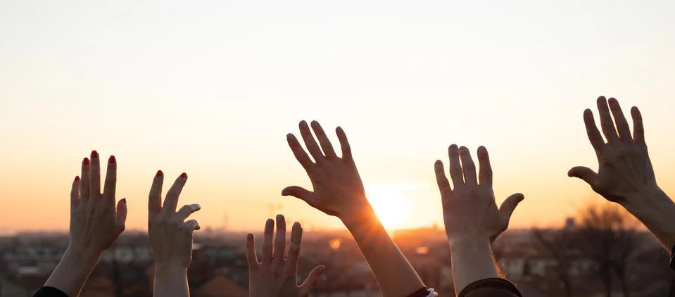 Hands up at the sunset Stock Photos