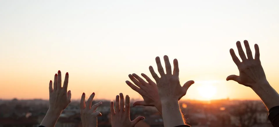 Hands up at the sunset Stock Photos