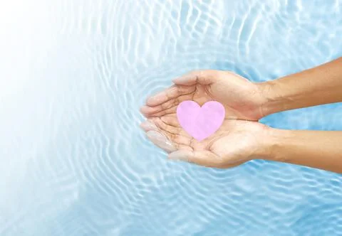 Hands on the surface of the water. Stock Photos
