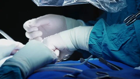 The hands of a surgeon Stock Footage 127702939