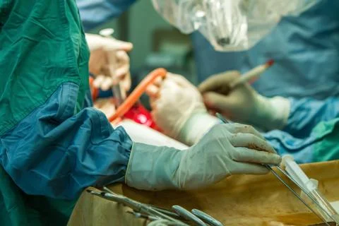 Hands of surgeons with tools. Stock Photos