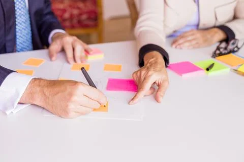 Hands on a table close-up during a coach training strategy, Organization of Stock Photos