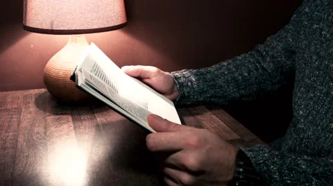 Hands on the table holding a book Video stock 56251281