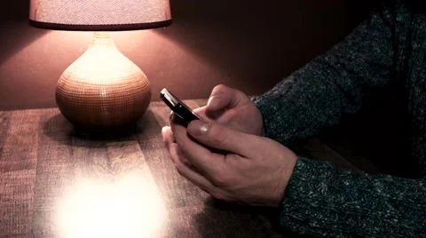 Hands on the table leaf smartphone Stock Footage 56240795