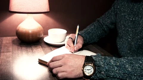Hands on the table writing in a notebook Stock Footage 56250890