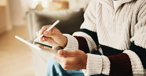 Hands, tablet and man with stylus in home for remote work, web design and Stock Photos