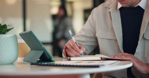 Hands, tablet and person writing in notebook for planning, agenda or financial Stock Footage 335782010