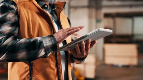 Hands, tablet and scroll in carpentry warehouse, check lumber order or onli.. Stock-Fotos
