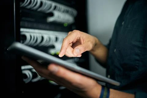 Hands, tablet and typing in server room, man and inspection with coding Stock Photos