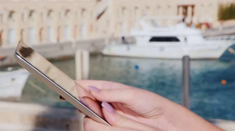 Hands with the tablet on the background of yachts Stock Footage 61154643