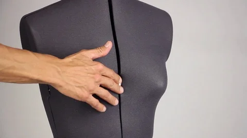 Hands tailor increase the size of breast on female sewing mannequin, side view Video stock 94364112