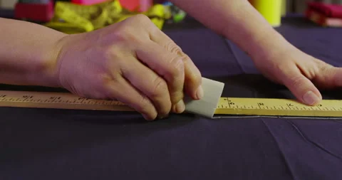 Hands Of Tailor Using Chalk To Mark Fabric Stock Footage 243459328