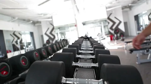 Hands take dumbbells Stock Footage 44026413