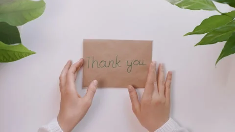 Hands take a envelope with the words Thank you and take out european money. Stock Footage 130906196